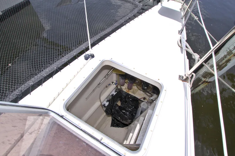 Route 66 Yacht Photos Pics Open hatch on 2005 Dolphin 460 Sail Catamaran deck, showing storage compartment.