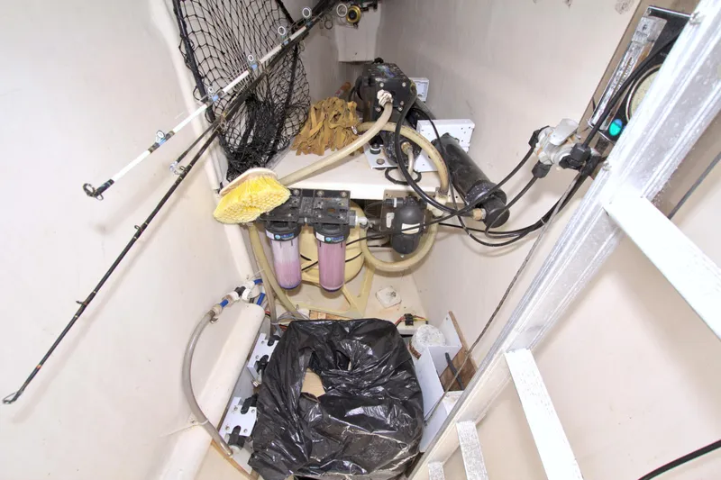 Route 66 Yacht Photos Pics Engine room of 2005 Dolphin 460 Sail Cat with fishing gear and equipment.