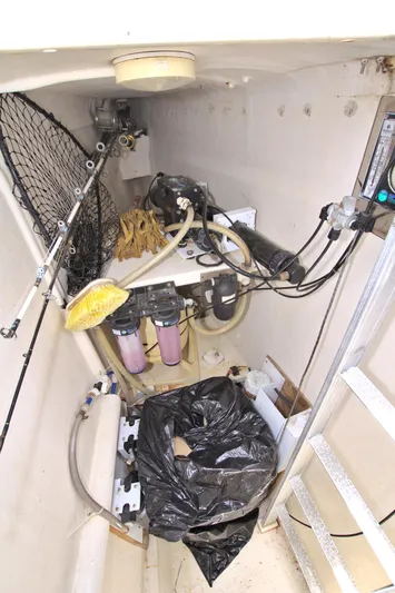 Route 66 Yacht Photos Pics Interior of 2005 Dolphin 460 Sail Cat showing equipment and storage area.