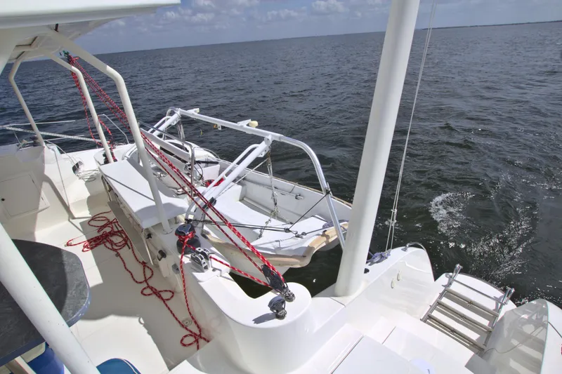 Route 66 Yacht Photos Pics 2005 Dolphin 460 Sail Cat on open water, featuring deck and rigging details.
