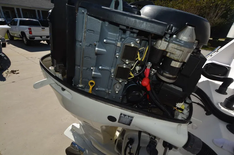 Hot Hooks Yacht Photos Pics Close-up of a 2006 Contender 33 Tournament boat engine, showcasing mechanical details.