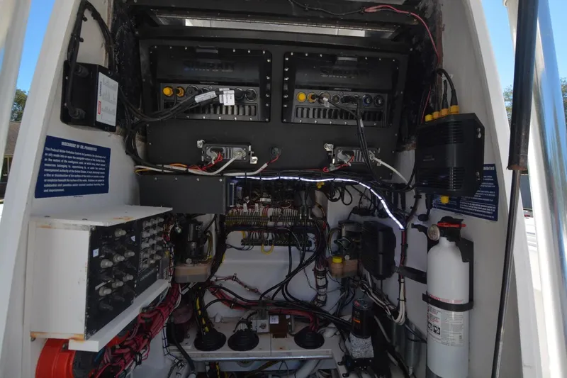 Hot Hooks Yacht Photos Pics Electrical system of a 2006 Contender 33 Tournament boat, showcasing wiring and components.