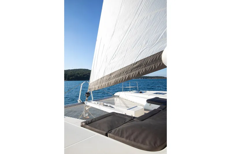 Aliana Yacht Photos Pics Sailing on a 2022 Lagoon 50 catamaran with open sea and clear sky.