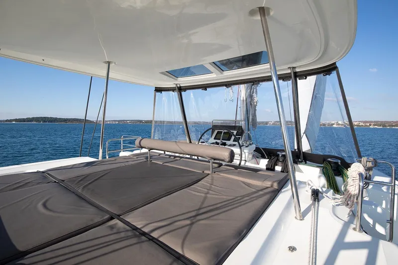 Aliana Yacht Photos Pics Luxurious 2022 Lagoon 50 catamaran with spacious deck and stunning ocean view.