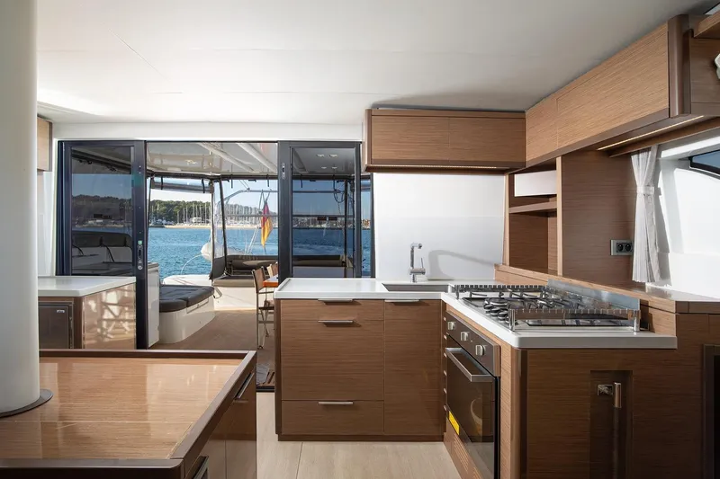 Aliana Yacht Photos Pics Modern kitchen interior on 2022 Lagoon 50 yacht with ocean view.