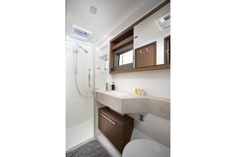 Aliana Yacht Photos Pics Modern bathroom interior of 2022 Lagoon 50 yacht, featuring sleek design and amenities.