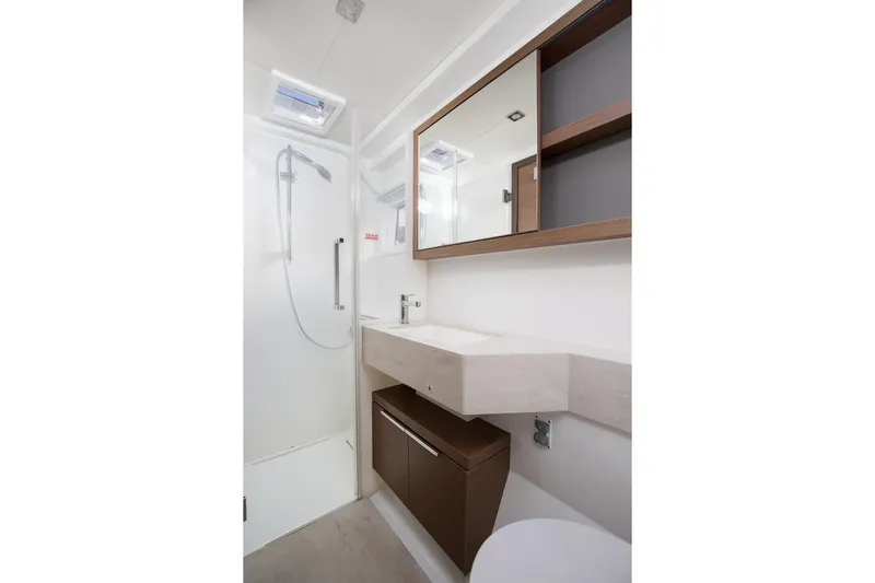 Aliana Yacht Photos Pics Modern bathroom in 2022 Lagoon 50 yacht with sleek shower and vanity.