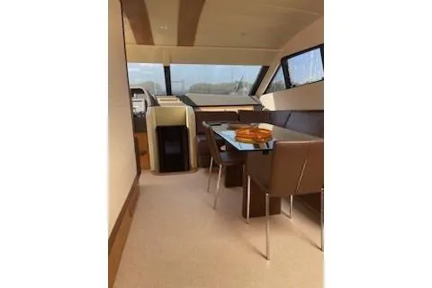  Yacht Photos Pics Interior of 2009 Ferretti Yachts 681, featuring elegant dining area and panoramic windows.