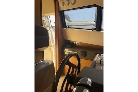  Yacht Photos Pics Interior helm of 2009 Ferretti Yachts 681, featuring steering wheel and control panel.