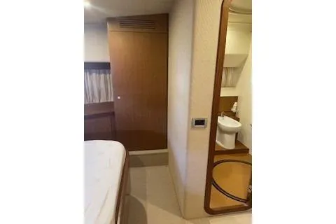  Yacht Photos Pics 2009 Ferretti Yachts 681 interior cabin with ensuite bathroom, featuring modern design.