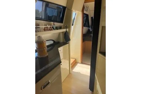  Yacht Photos Pics Interior view of 2009 Ferretti Yachts 681, featuring sleek cabinetry and modern design.