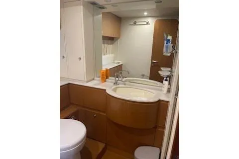  Yacht Photos Pics Luxurious bathroom in 2009 Ferretti Yachts 681, featuring modern fixtures and elegant design.