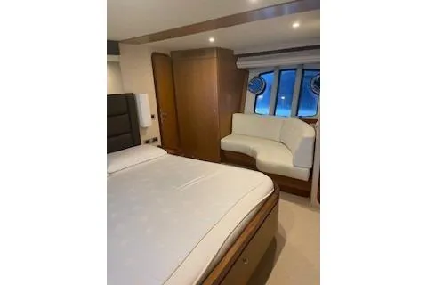  Yacht Photos Pics Luxurious bedroom interior of 2009 Ferretti Yachts 681 with elegant furnishings.