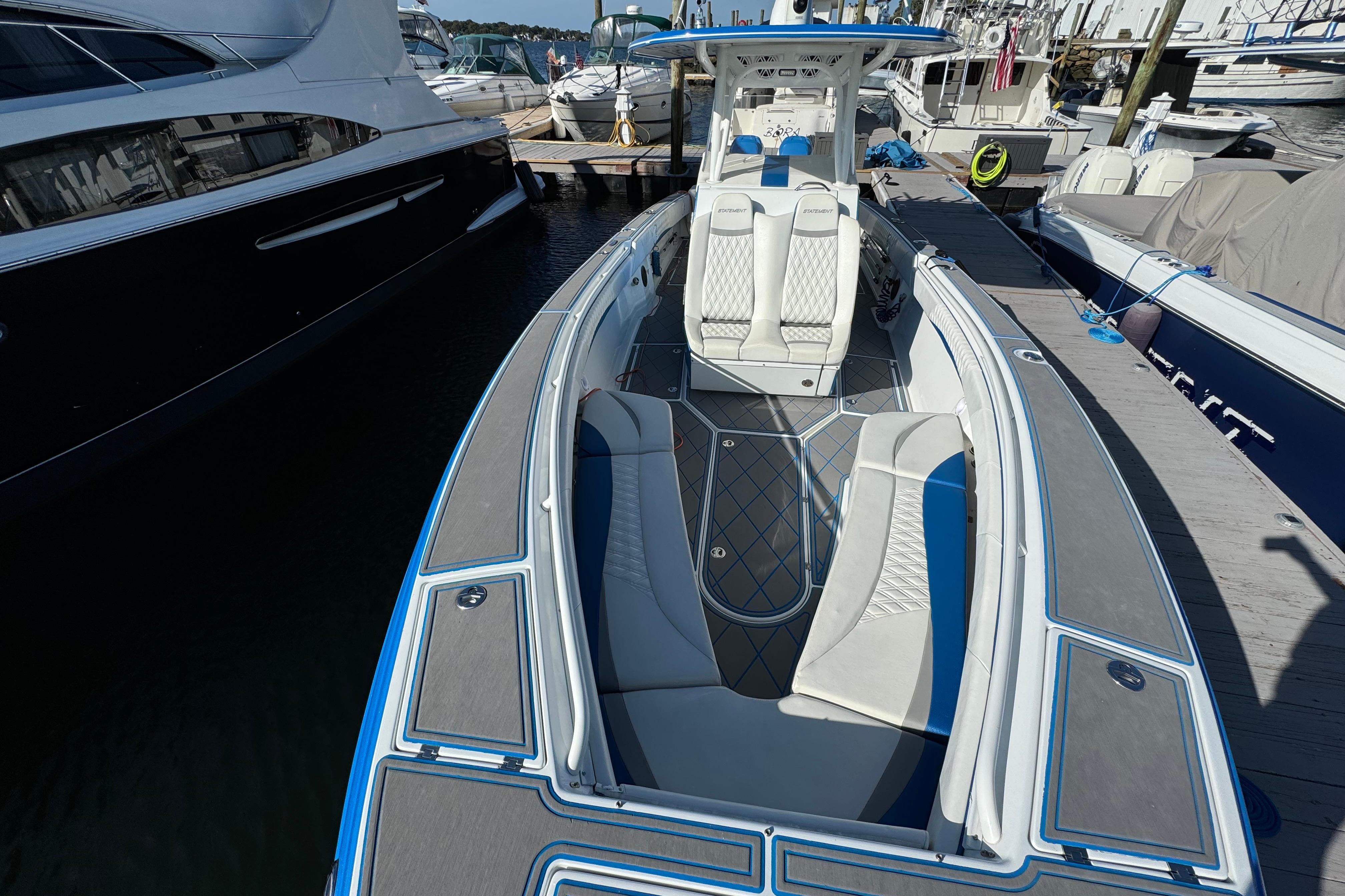 2016 Statement 350 Open boat docked, featuring sleek design and spacious seating.