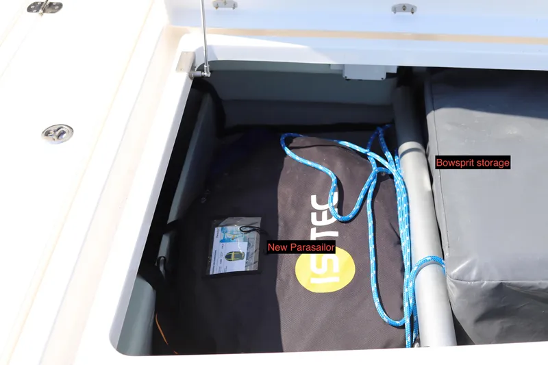 Why Knot Yacht Photos Pics Storage compartment on a 2020 Robertson Leopard boat with parasail and bowsprit.