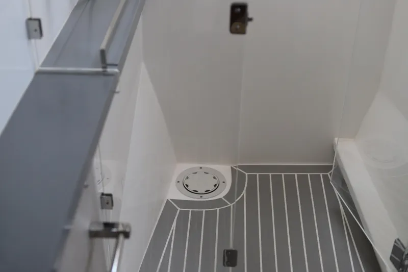 Why Knot Yacht Photos Pics 2020 Robertson Leopard yacht interior with sleek, modern design and striped flooring.