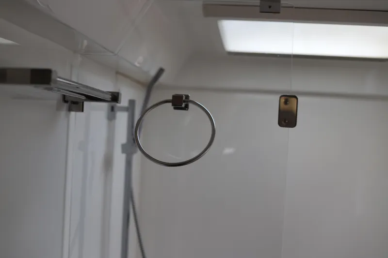 Why Knot Yacht Photos Pics Modern bathroom interior with metal towel ring and glass shower door, Robertson Leopard 2020 model.