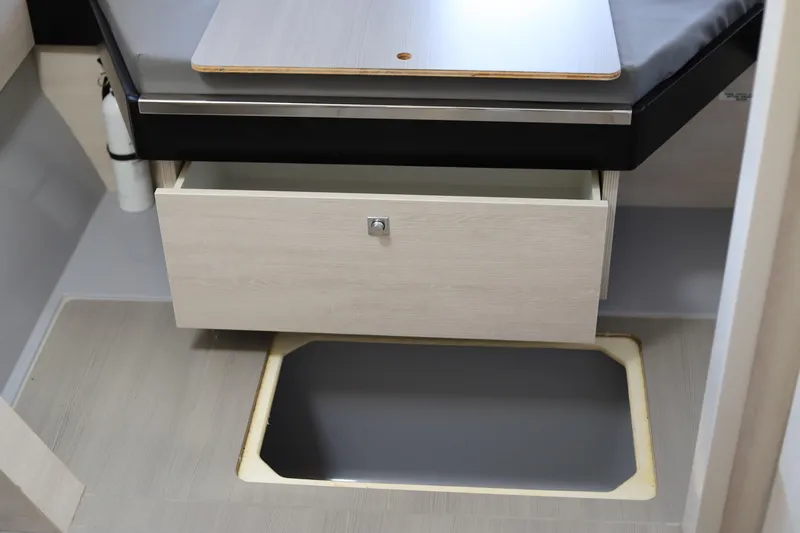 Why Knot Yacht Photos Pics 2020 Robertson Leopard interior with open drawer and storage compartment.