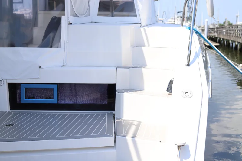 Why Knot Yacht Photos Pics 2020 Robertson Leopard yacht with sleek white steps and dockside view.