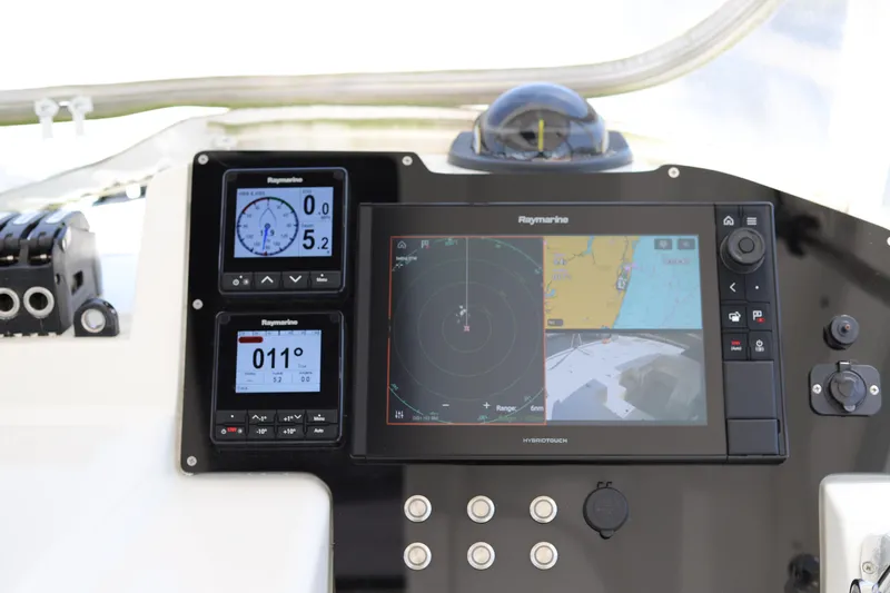Why Knot Yacht Photos Pics Control panel of a 2020 Robertson Leopard boat with navigation displays.