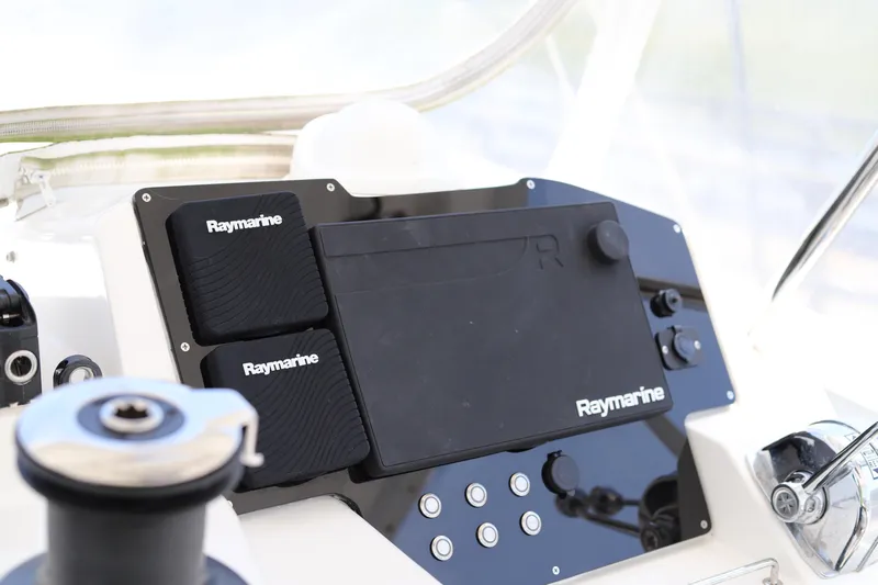 Why Knot Yacht Photos Pics Control panel of a 2020 Robertson Leopard boat featuring Raymarine navigation equipment.