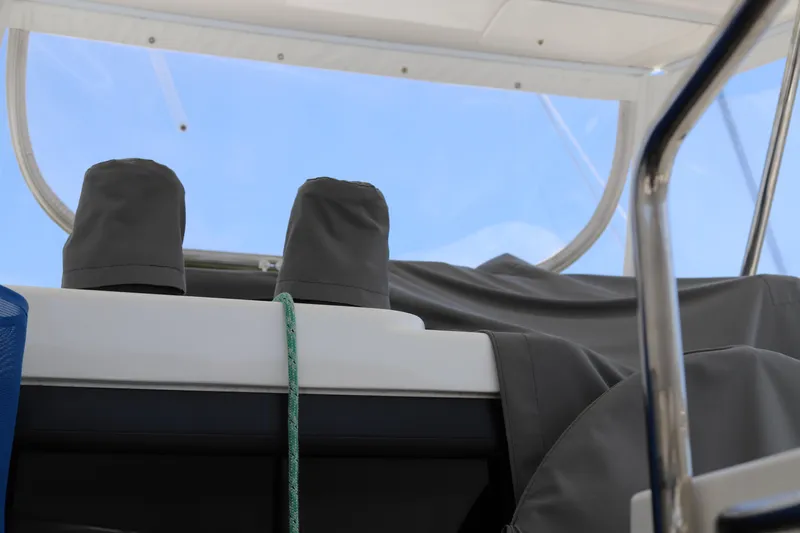 Why Knot Yacht Photos Pics Covered equipment on a 2020 Robertson Leopard boat, with clear sky background.