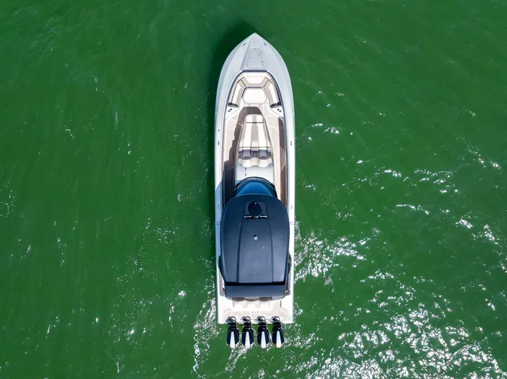  Yacht Photos Pics Aerial view of 2021 MTI V42 boat on green water.