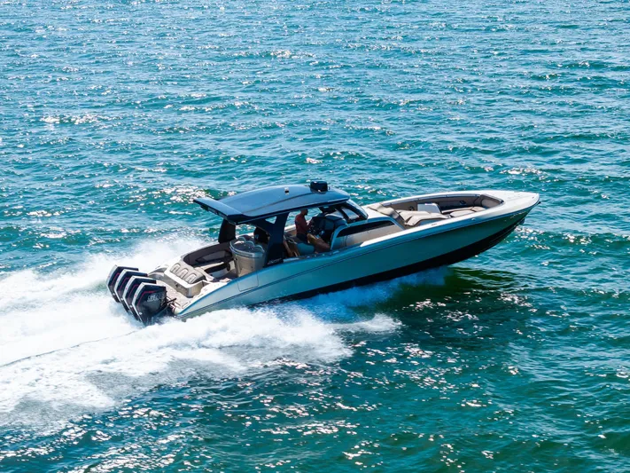  Yacht Photos Pics 2021 MTI V42 boat cruising on open water with powerful engines.
