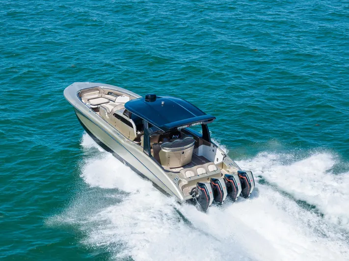  Yacht Photos Pics 2021 MTI V42 boat cruising on open water with powerful engines.