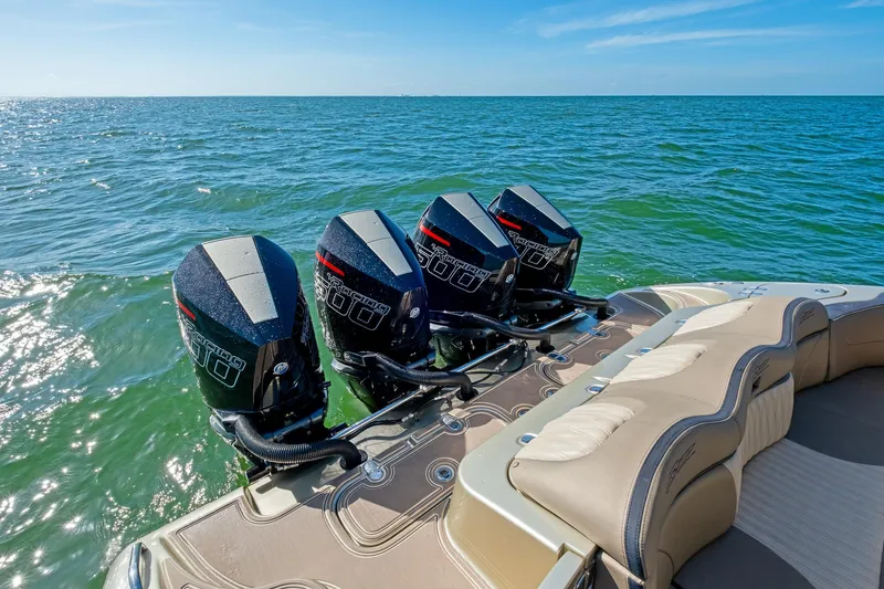  Yacht Photos Pics Four powerful outboard motors on a 2021 MTI V42 boat, cruising on open water.