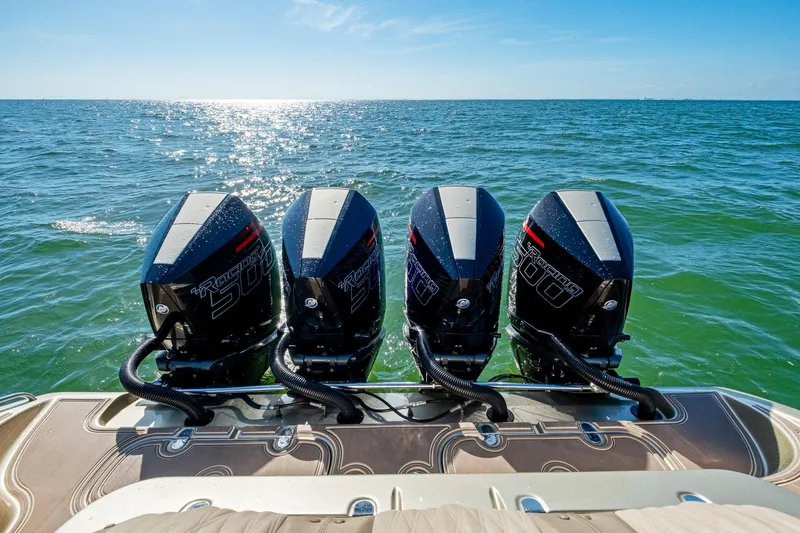  Yacht Photos Pics Four powerful outboard motors on MTI V42 boat, 2021 model, cruising on open sea.