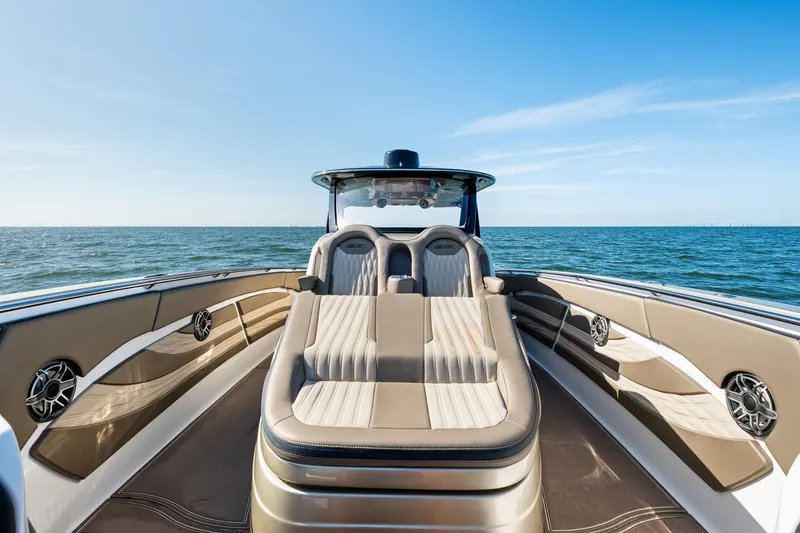  Yacht Photos Pics Luxury MTI V42 boat interior with plush seating, ocean view, and sleek design, 2021 model.