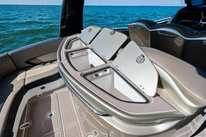  Yacht Photos Pics Luxury MTI V42 boat interior with open storage compartments, 2021 model, on a calm sea.