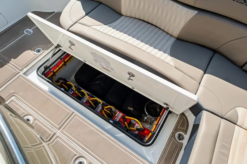  Yacht Photos Pics 2021 MTI V42 boat storage compartment with open lid, revealing organized cables and equipment.