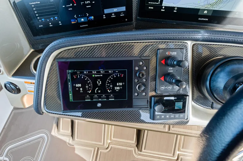  Yacht Photos Pics Dashboard of 2021 MTI V42 boat with digital controls and navigation screens.