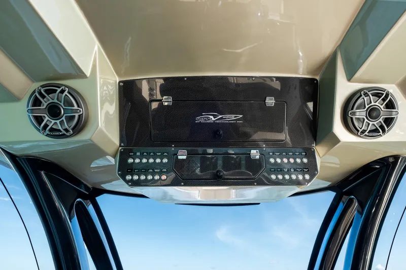  Yacht Photos Pics Control panel of 2021 MTI V42 boat with speakers and switches.