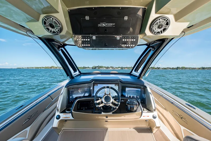  Yacht Photos Pics Cockpit view of 2021 MTI V42 boat with advanced navigation system on open water.