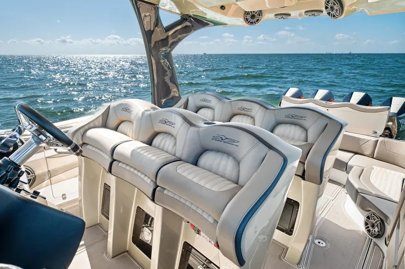  Yacht Photos Pics Luxurious MTI V42 boat interior with plush seating, overlooking the ocean, 2021 model.