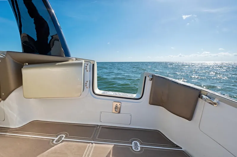  Yacht Photos Pics MTI V42 boat interior with ocean view, 2021 model, under clear blue sky.