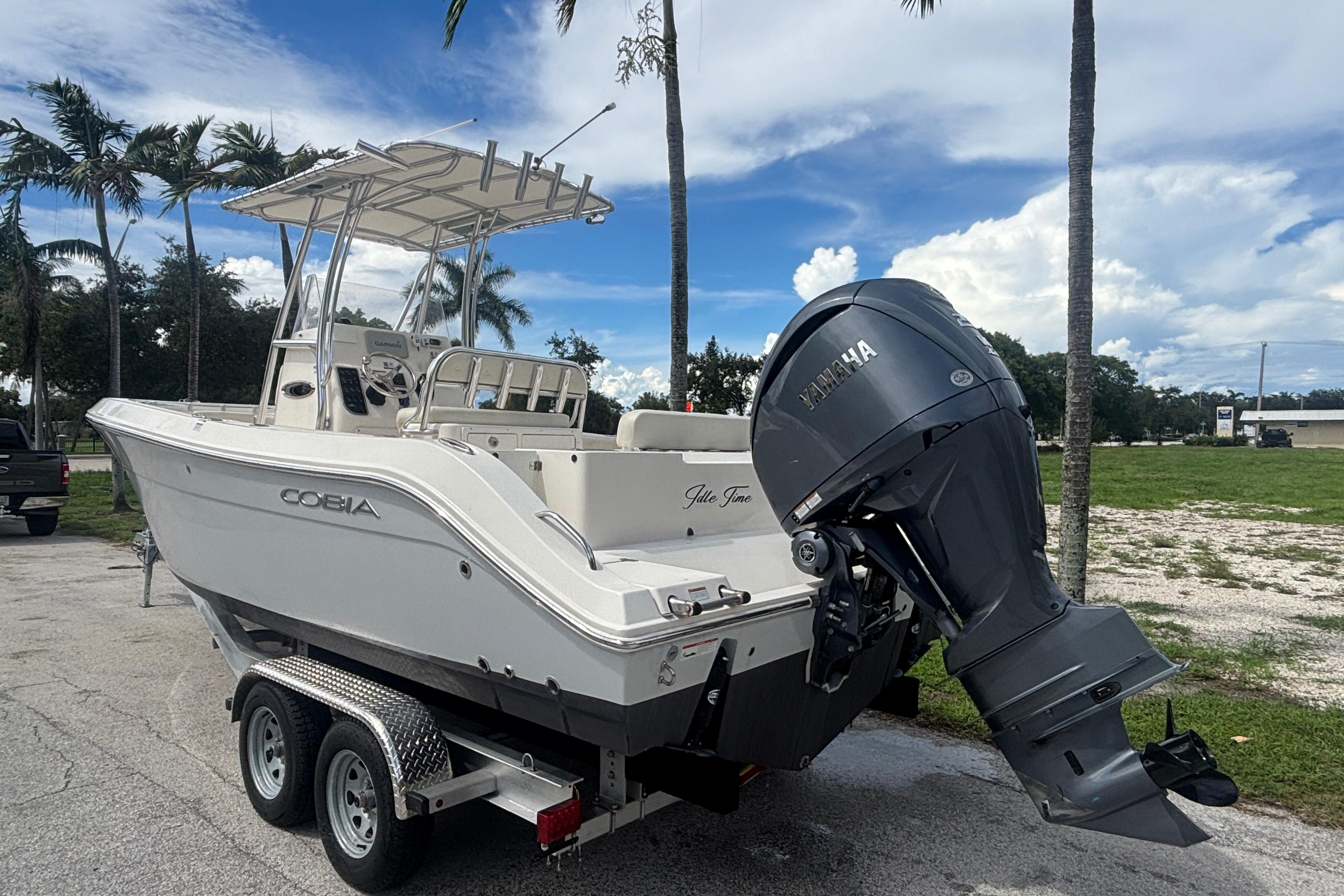 2022 Cobia 237 Center Console boat on trailer with Yamaha outboard motor.