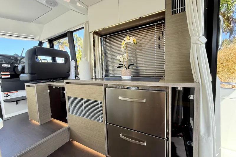  Yacht Photos Pics 2024 Jeanneau NC 1295 Fly interior with modern kitchen and elegant design.