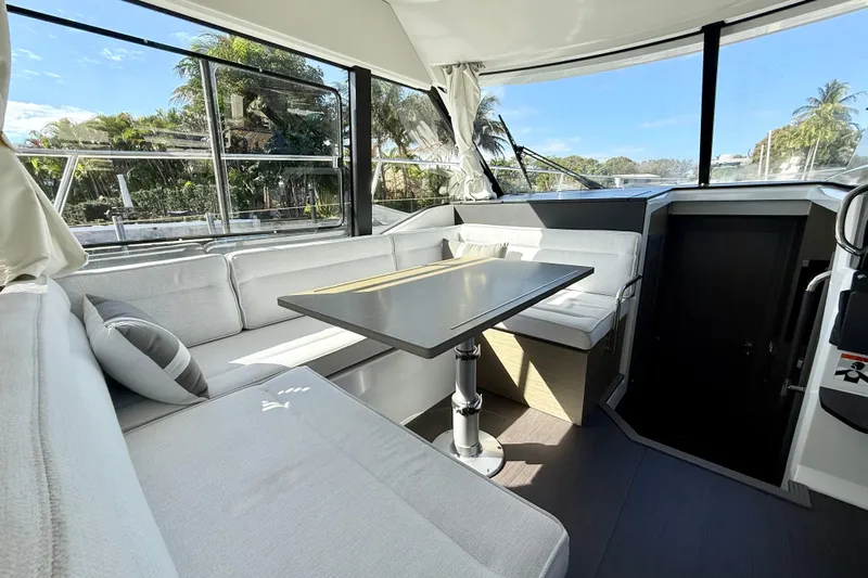  Yacht Photos Pics Interior of 2024 Jeanneau NC 1295 Fly yacht with modern seating and table.