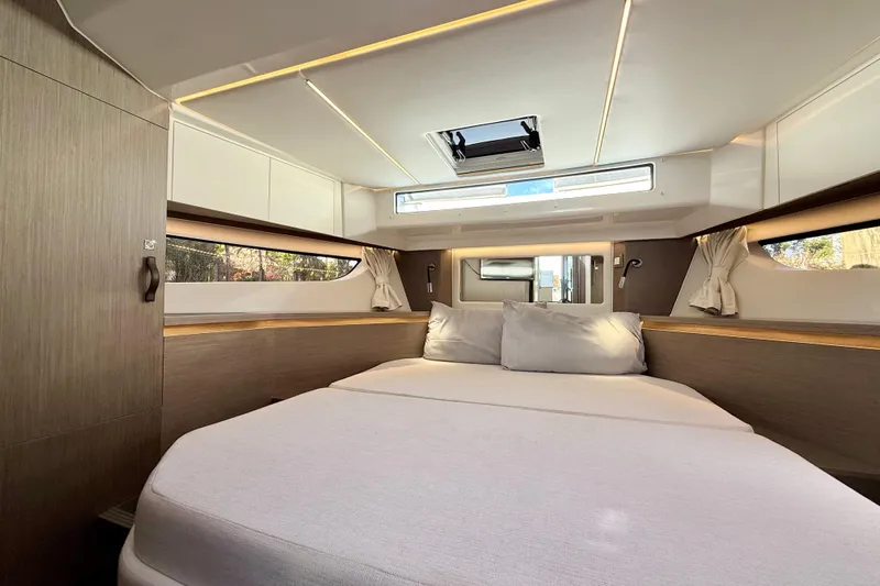  Yacht Photos Pics Luxurious cabin interior of 2024 Jeanneau NC 1295 Fly yacht with modern design.
