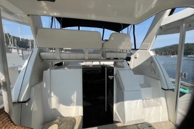  Yacht Photos Pics 1999 Carver 404 Cockpit Motor Yacht interior with seating and scenic marina view.