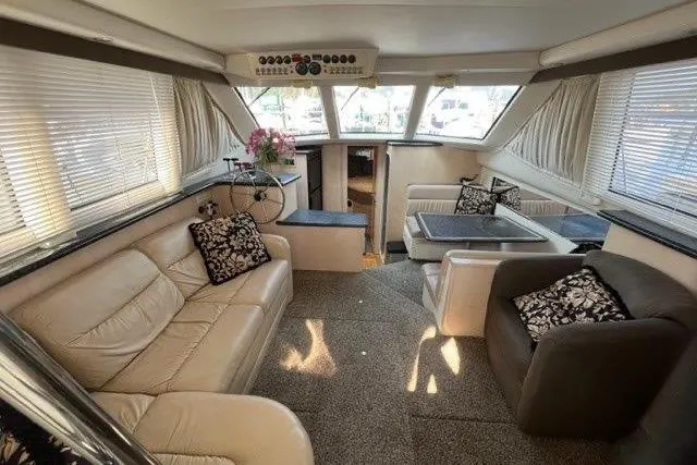  Yacht Photos Pics Luxurious interior of a 1999 Carver 404 Cockpit Motor Yacht with plush seating and elegant decor.