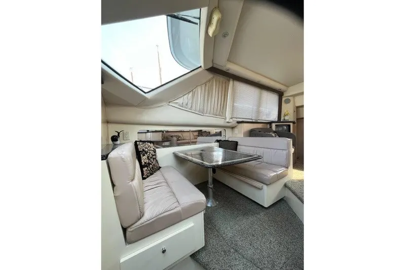  Yacht Photos Pics Interior of 1999 Carver 404 Cockpit Motor Yacht with cozy seating and dining area.