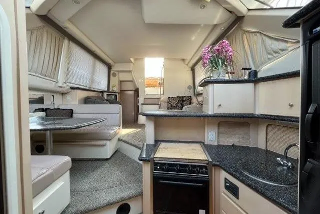  Yacht Photos Pics Interior of 1999 Carver 404 Cockpit Motor Yacht with modern kitchen and seating area.