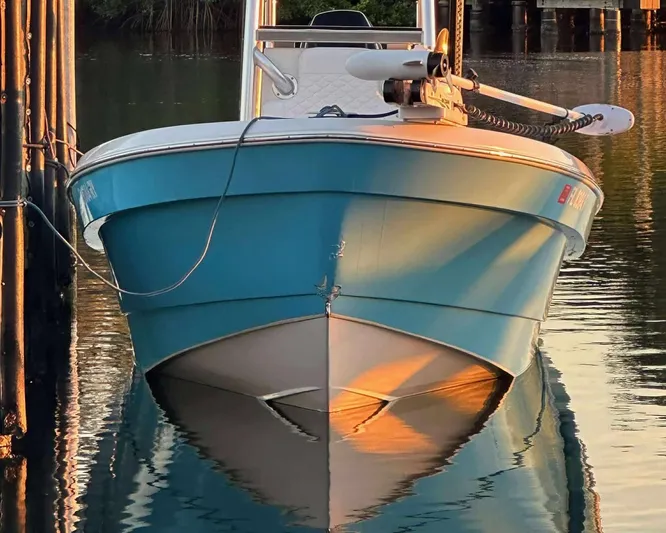  Yacht Photos Pics 2007 Andros Tarpon 26 boat docked, reflecting on calm water at sunset.