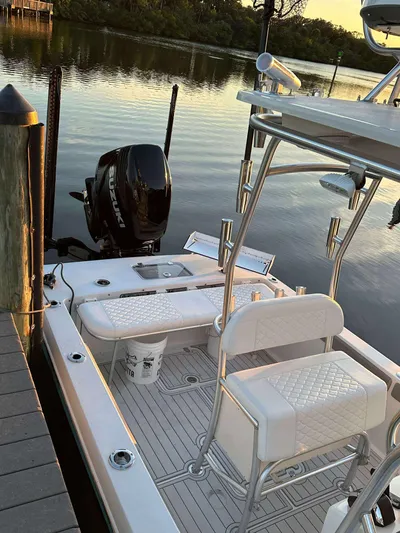  Yacht Photos Pics 2007 Andros Tarpon 26 boat with Suzuki engine docked by calm waters.