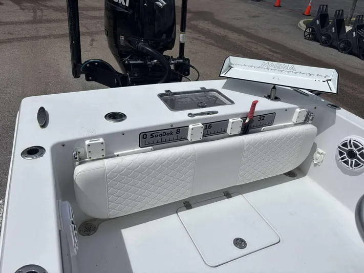  Yacht Photos Pics 2007 Andros Tarpon 26 boat interior with white seating and fishing equipment.